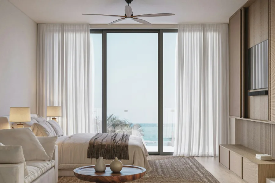 Chambre avec un lit canapé et brasseur d'air